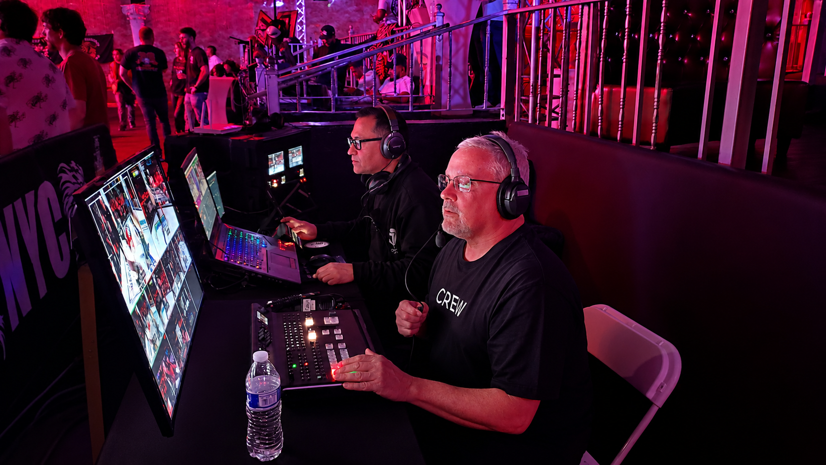 Shows the production team actively operating the broadcast.