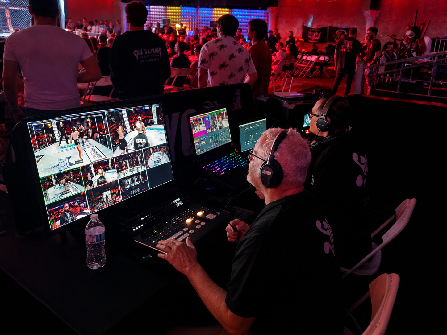 Connects the control area with the live audience and venue environment.